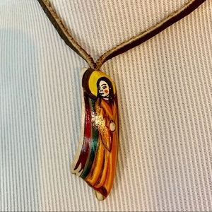 Wood carved figurine necklace